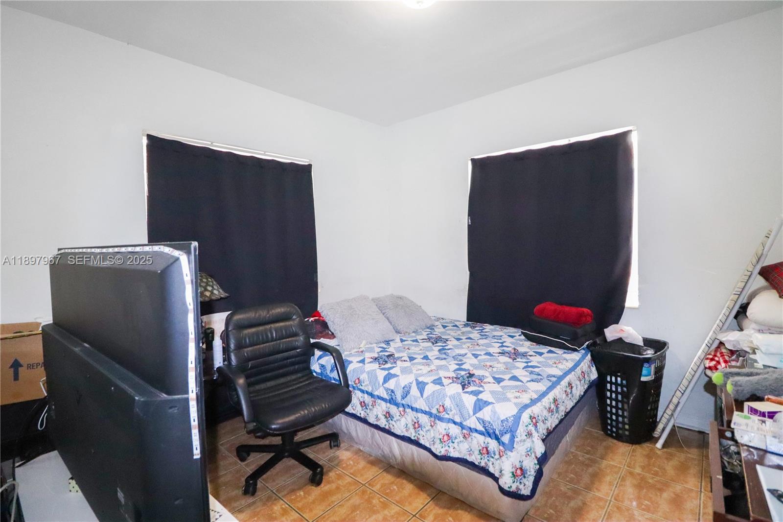 333 Southwest 30th Avenue Miami, FL 33135 - Photo 9 of 27 a bedroom with a bed and dresser