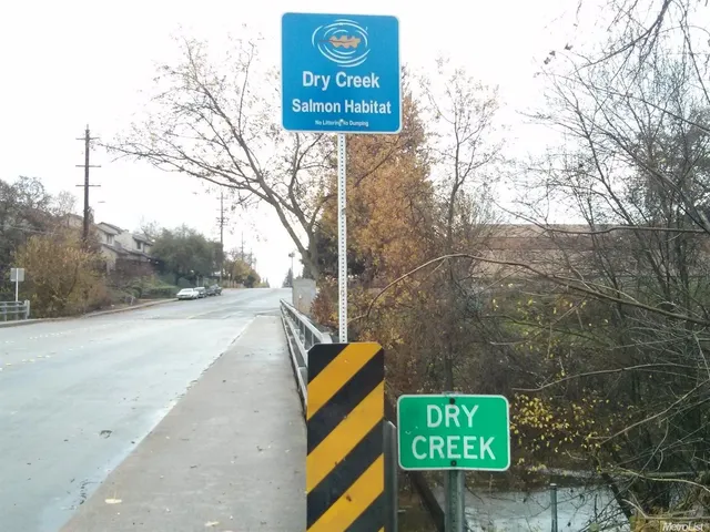 a sign that is on the side of a road