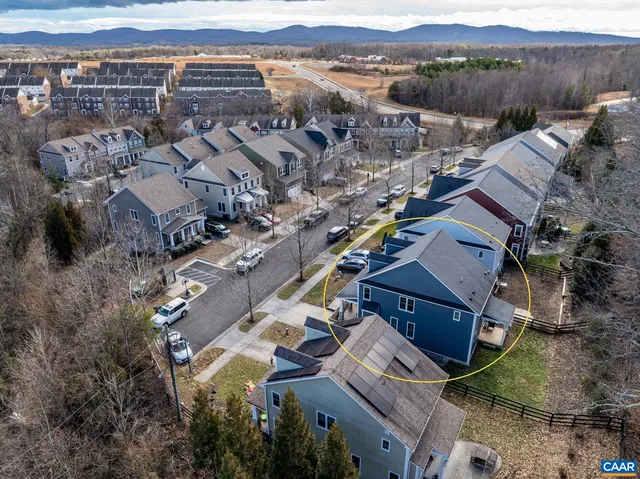 a aerial view of a house with a yard