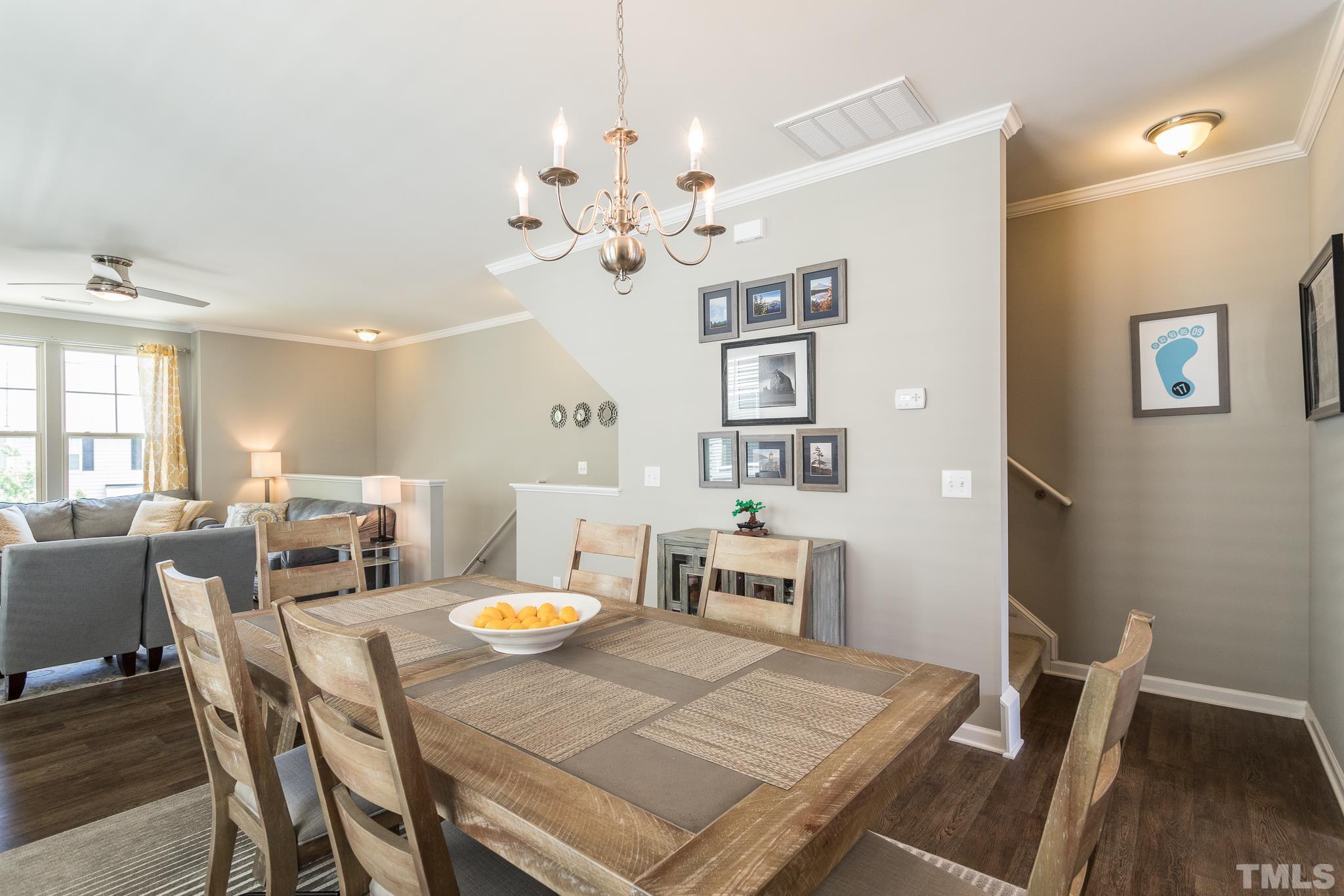 218 Irving Way Durham, NC 27703 - Photo 11 of 41 a view of a dining room with furniture and wooden floor