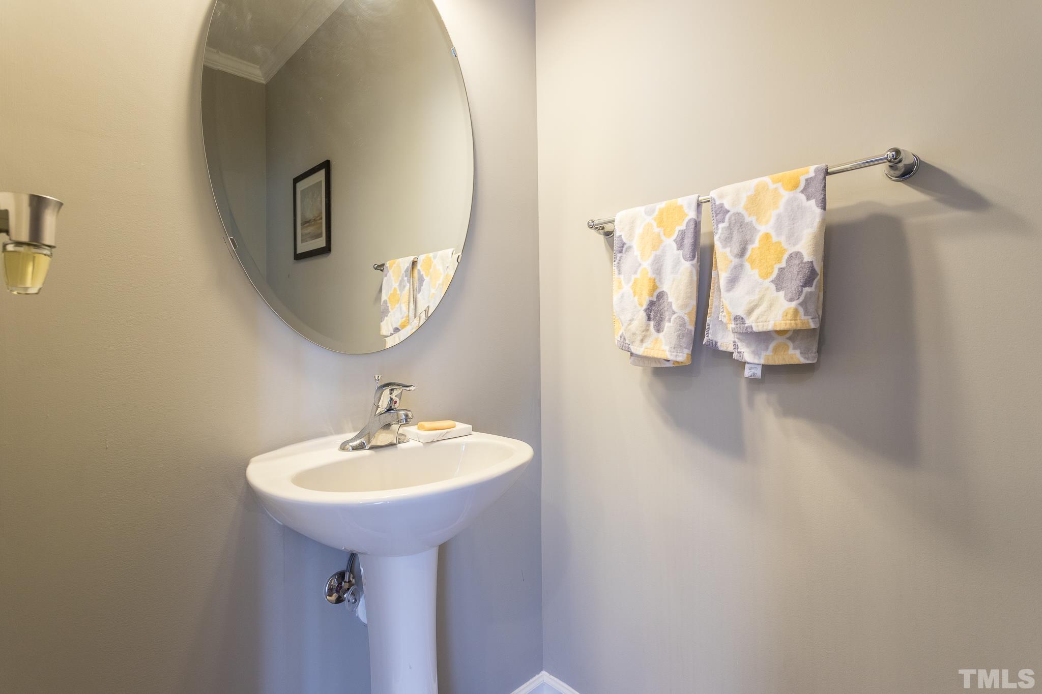 218 Irving Way Durham, NC 27703 - Photo 17 of 41 a bathroom with a sink and mirror