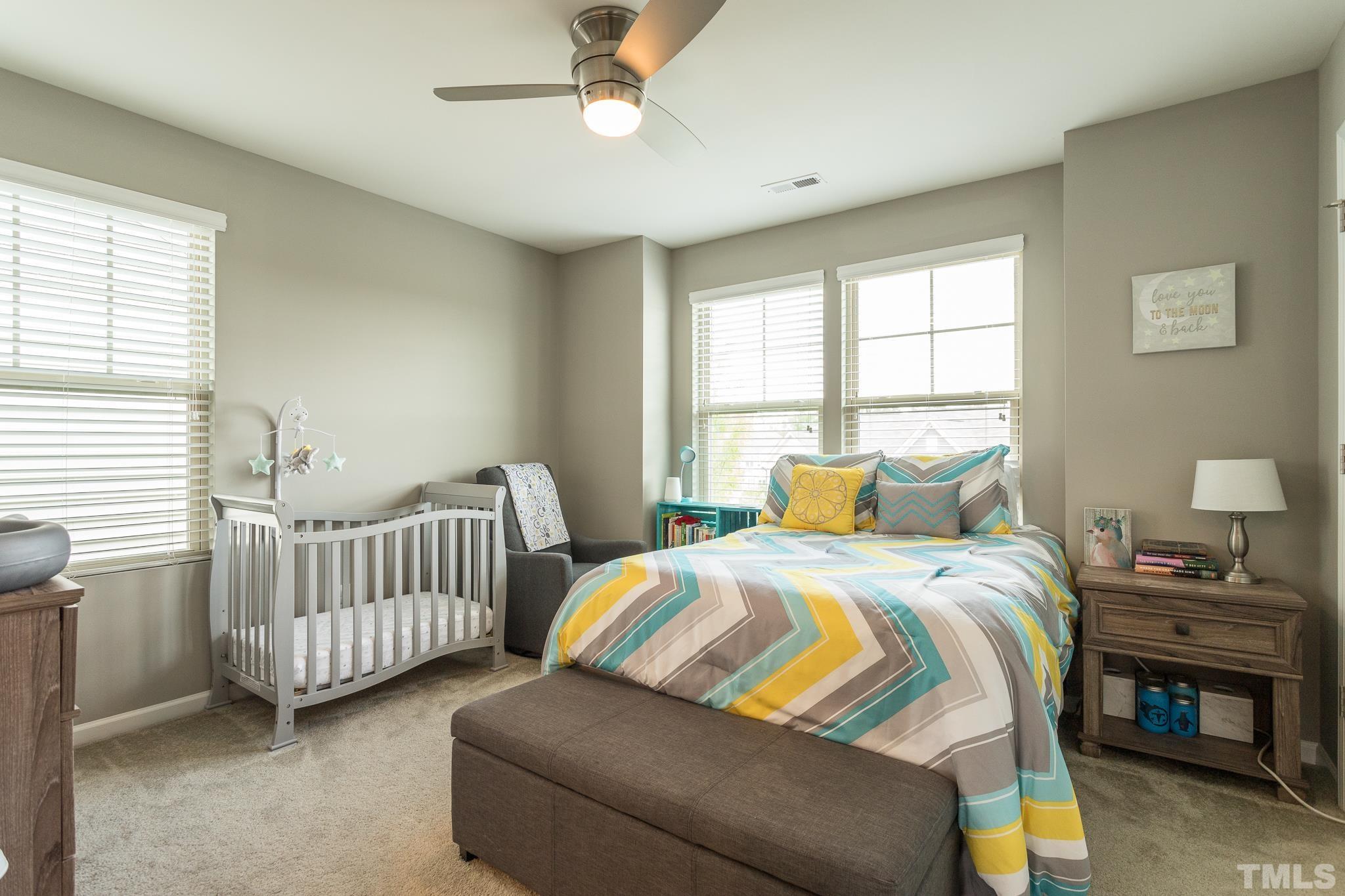 218 Irving Way Durham, NC 27703 - Photo 21 of 41 a bedroom with two beds and a window