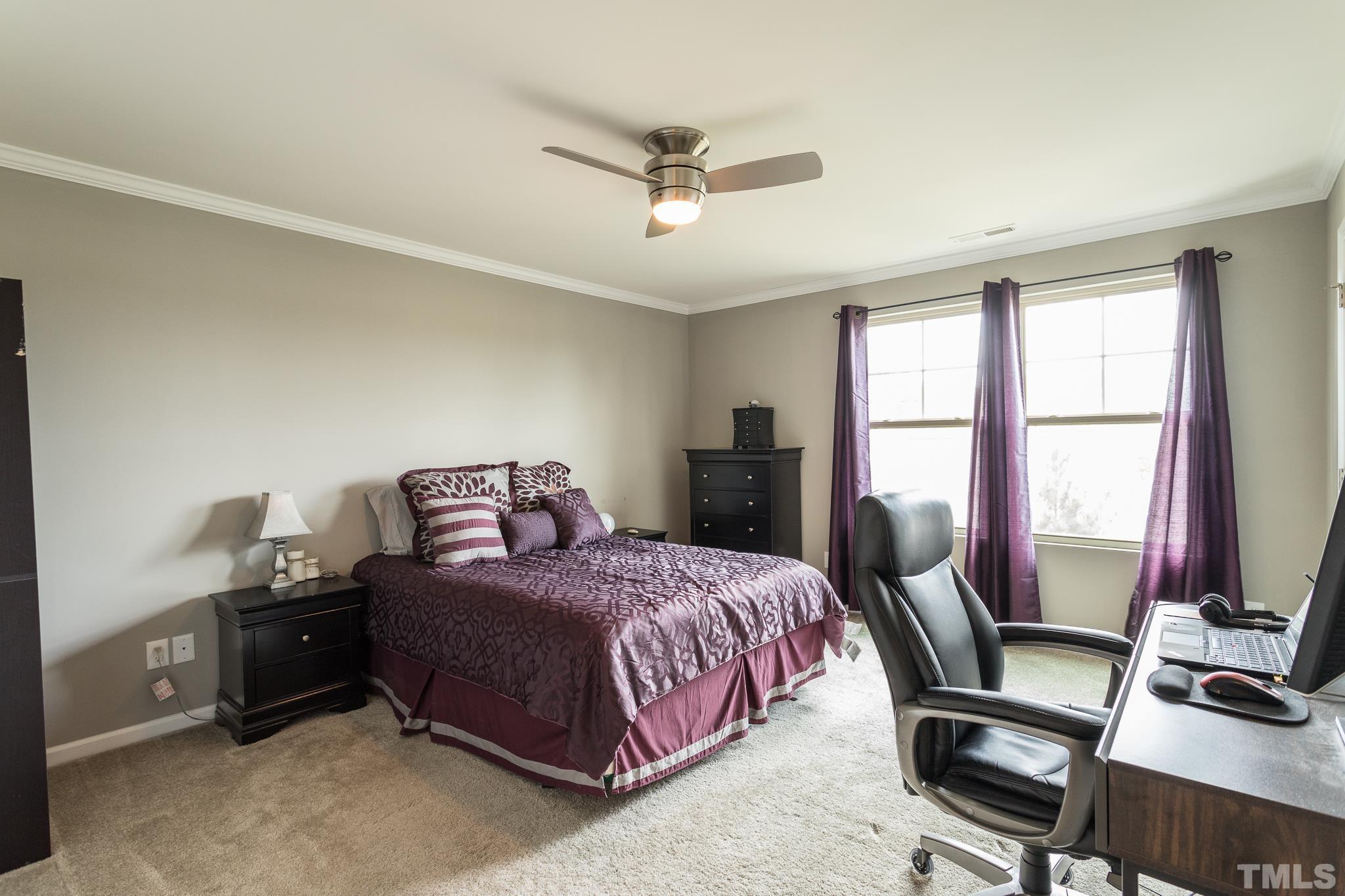 218 Irving Way Durham, NC 27703 - Photo 23 of 41 a bedroom with a bed wooden floor and a window
