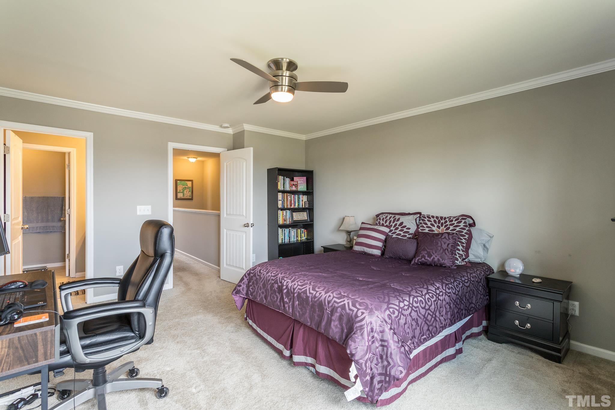 218 Irving Way Durham, NC 27703 - Photo 24 of 41 a bedroom with a bed chair and the view of the window