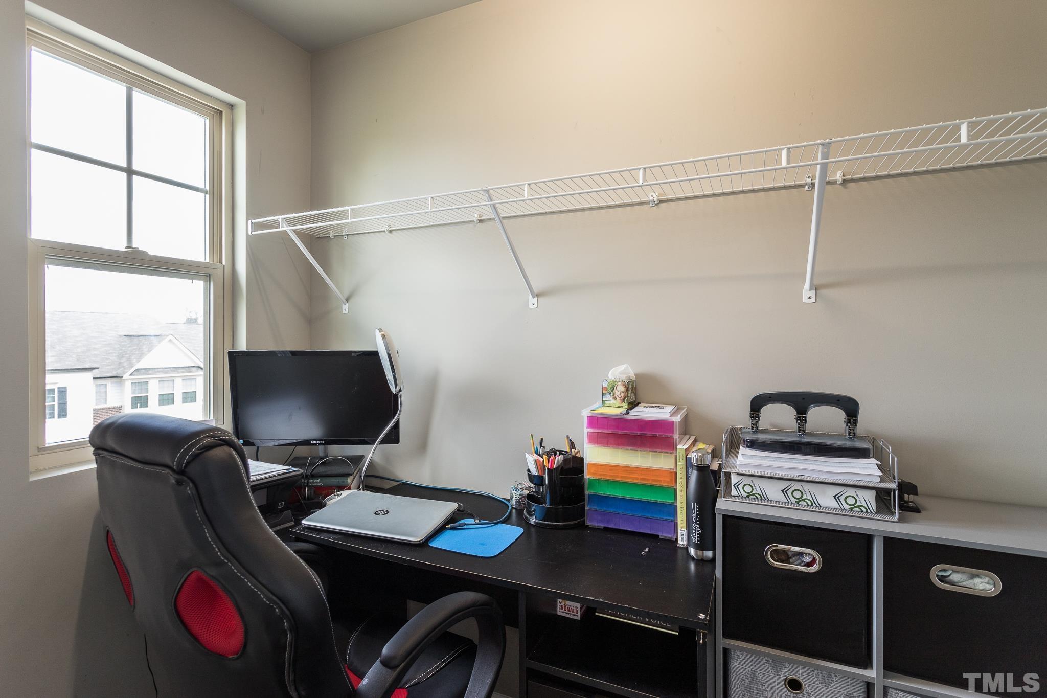 218 Irving Way Durham, NC 27703 - Photo 28 of 41 a room with a workspace