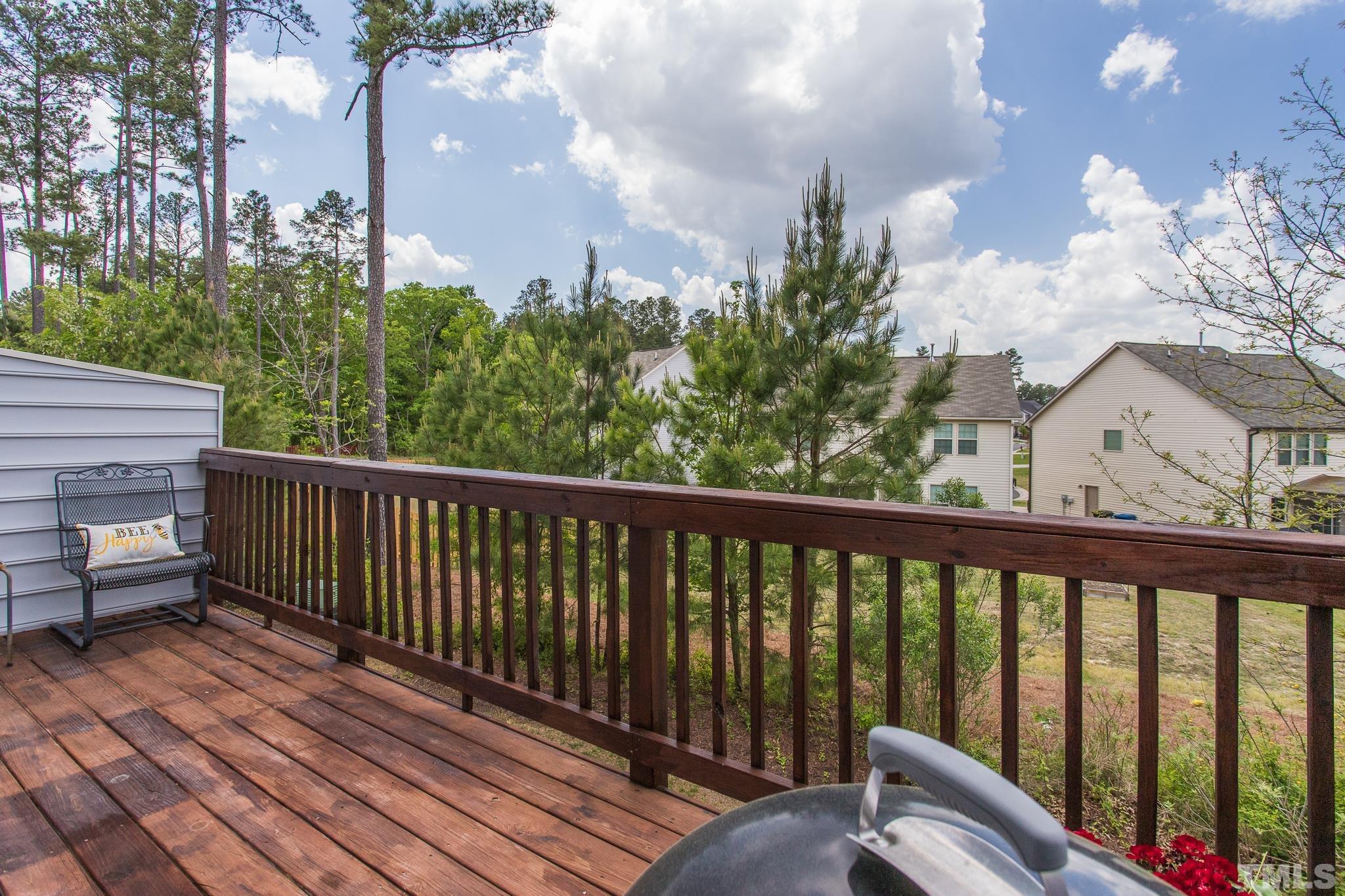 218 Irving Way Durham, NC 27703 - Photo 29 of 41 a balcony with wooden floor and fence