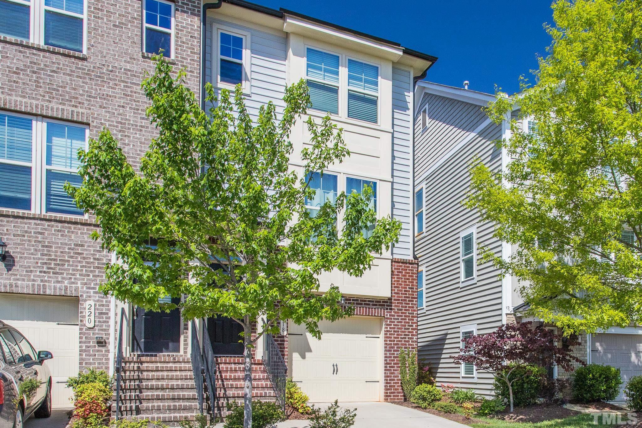 218 Irving Way Durham, NC 27703 - Photo 3 of 41 a front view of a house with plants