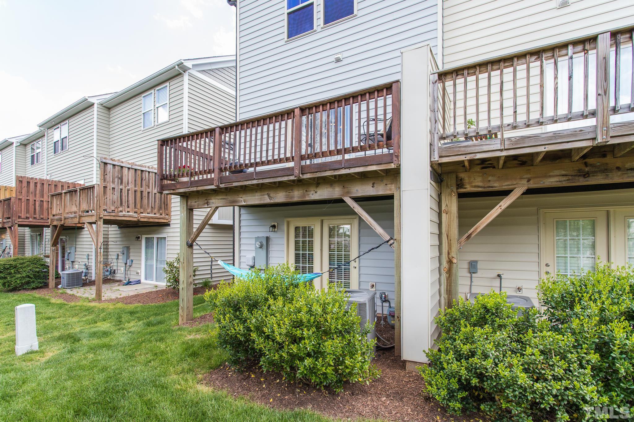 218 Irving Way Durham, NC 27703 - Photo 31 of 41 a view of a house with brick walls and a yard