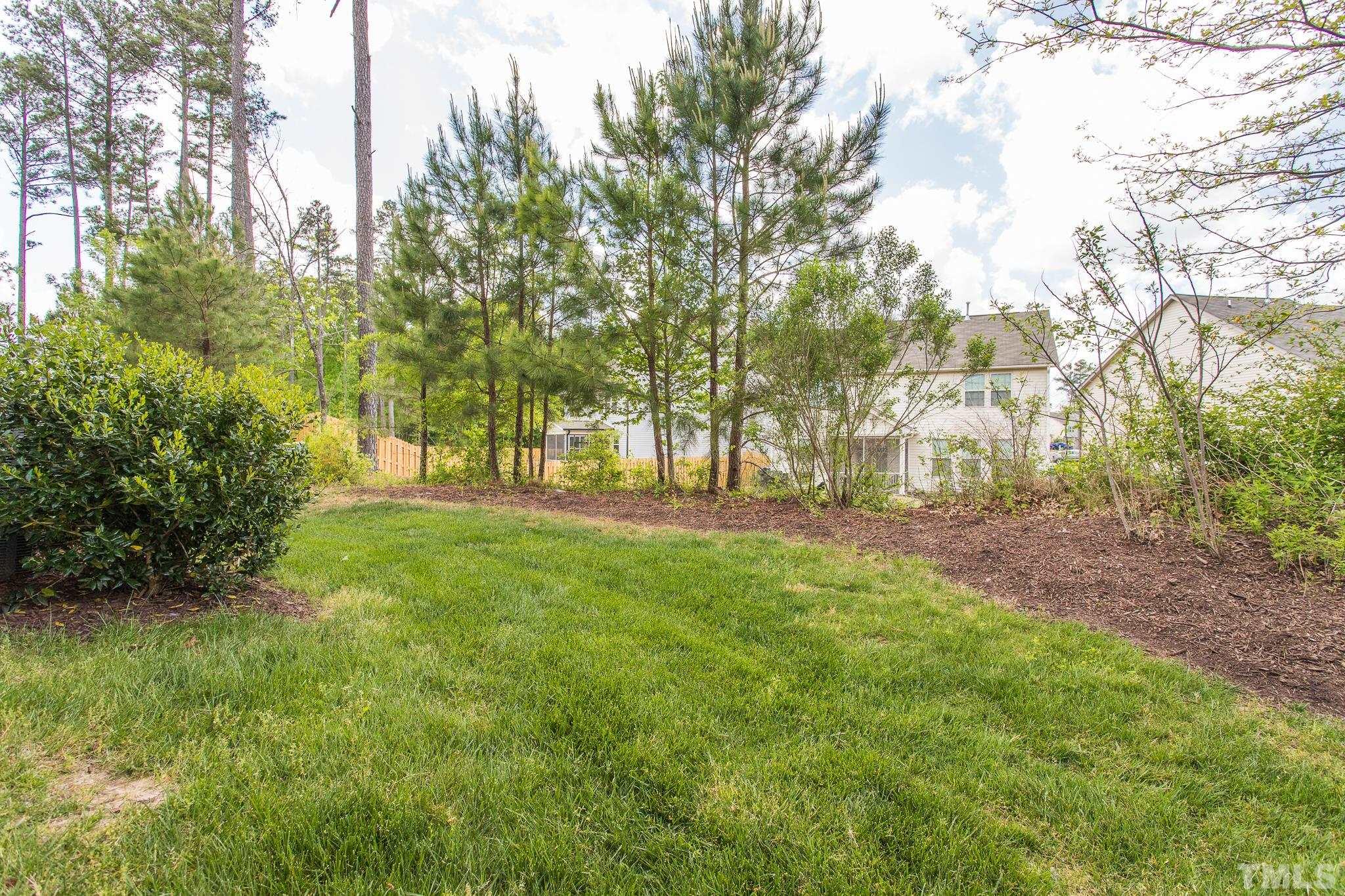 218 Irving Way Durham, NC 27703 - Photo 35 of 41 a view of outdoor space with trees all around