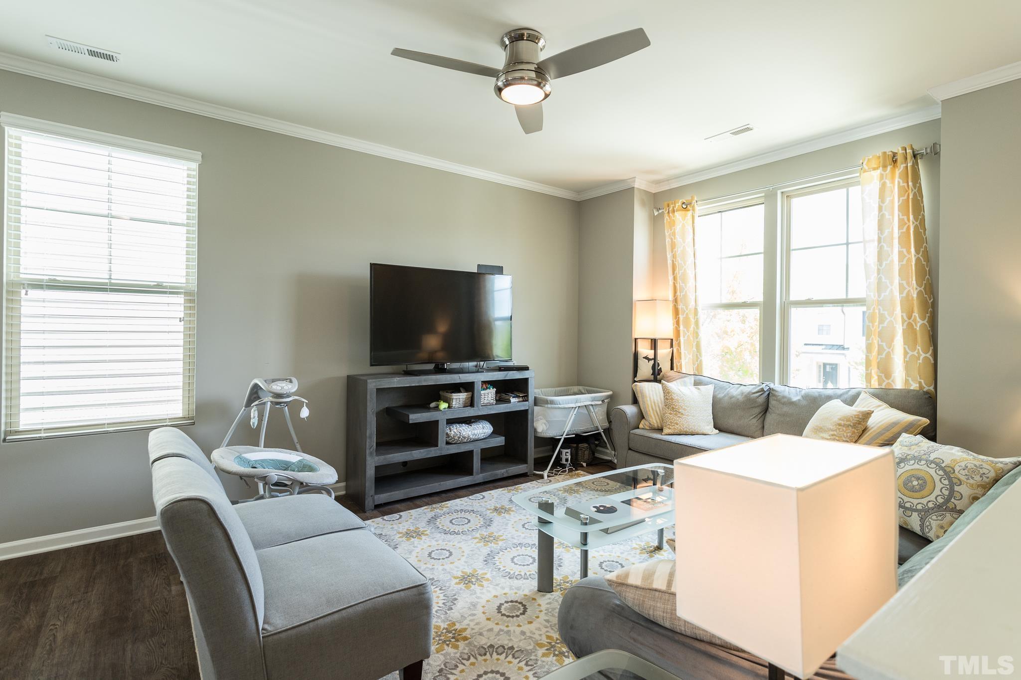 218 Irving Way Durham, NC 27703 - Photo 4 of 41 a living room with furniture and a flat screen tv