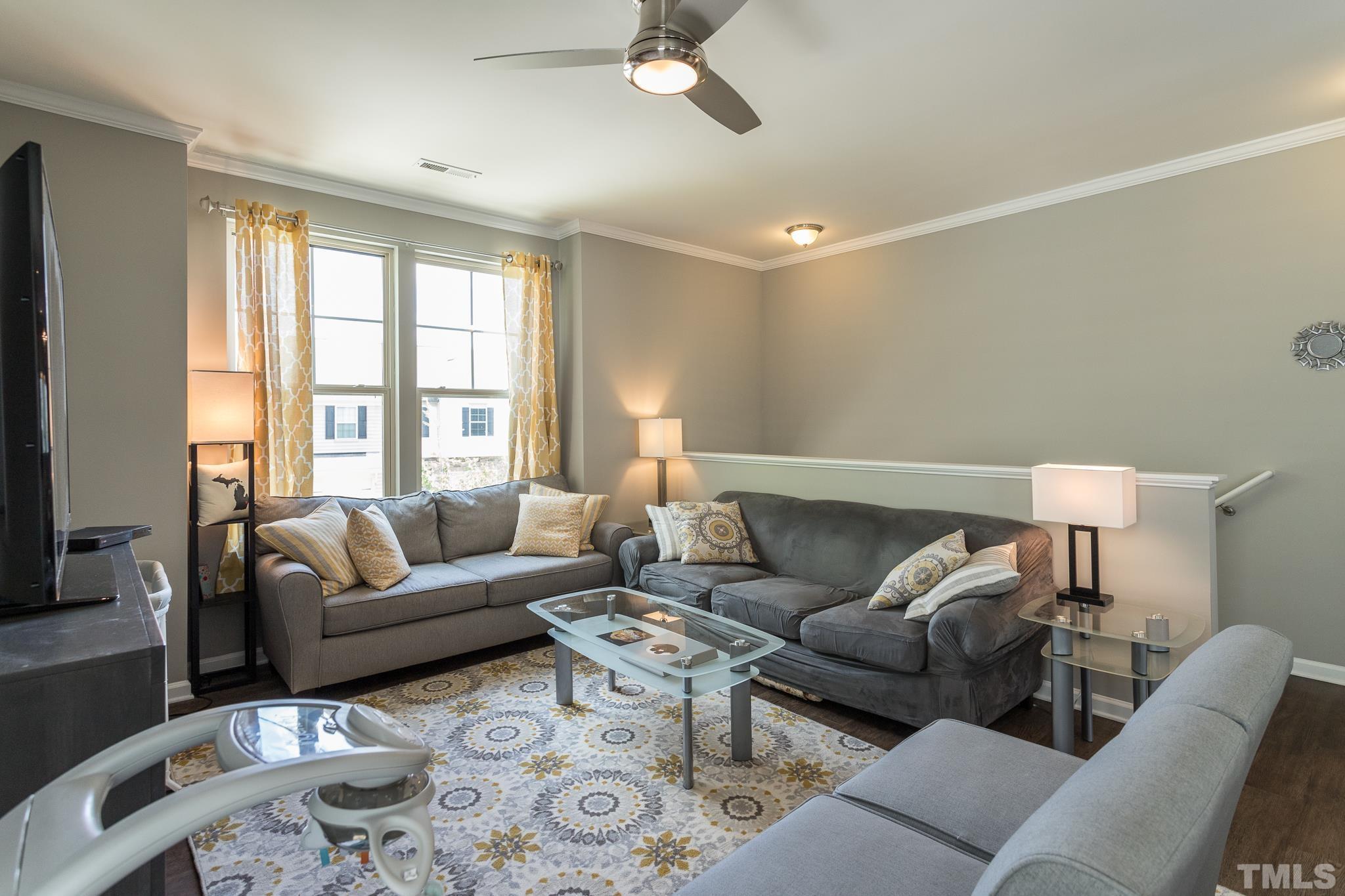 218 Irving Way Durham, NC 27703 - Photo 5 of 41 a living room with furniture and a large window