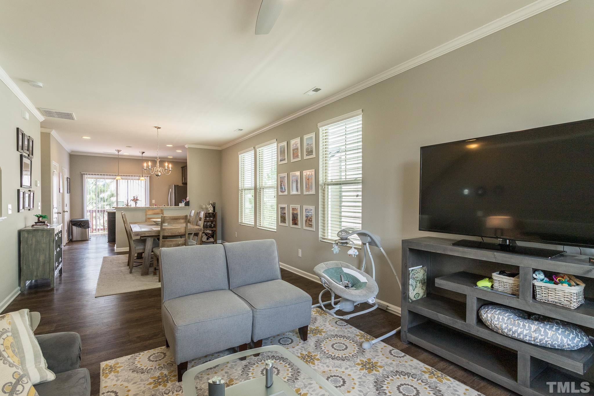 218 Irving Way Durham, NC 27703 - Photo 7 of 41 a living room with furniture and a flat screen tv