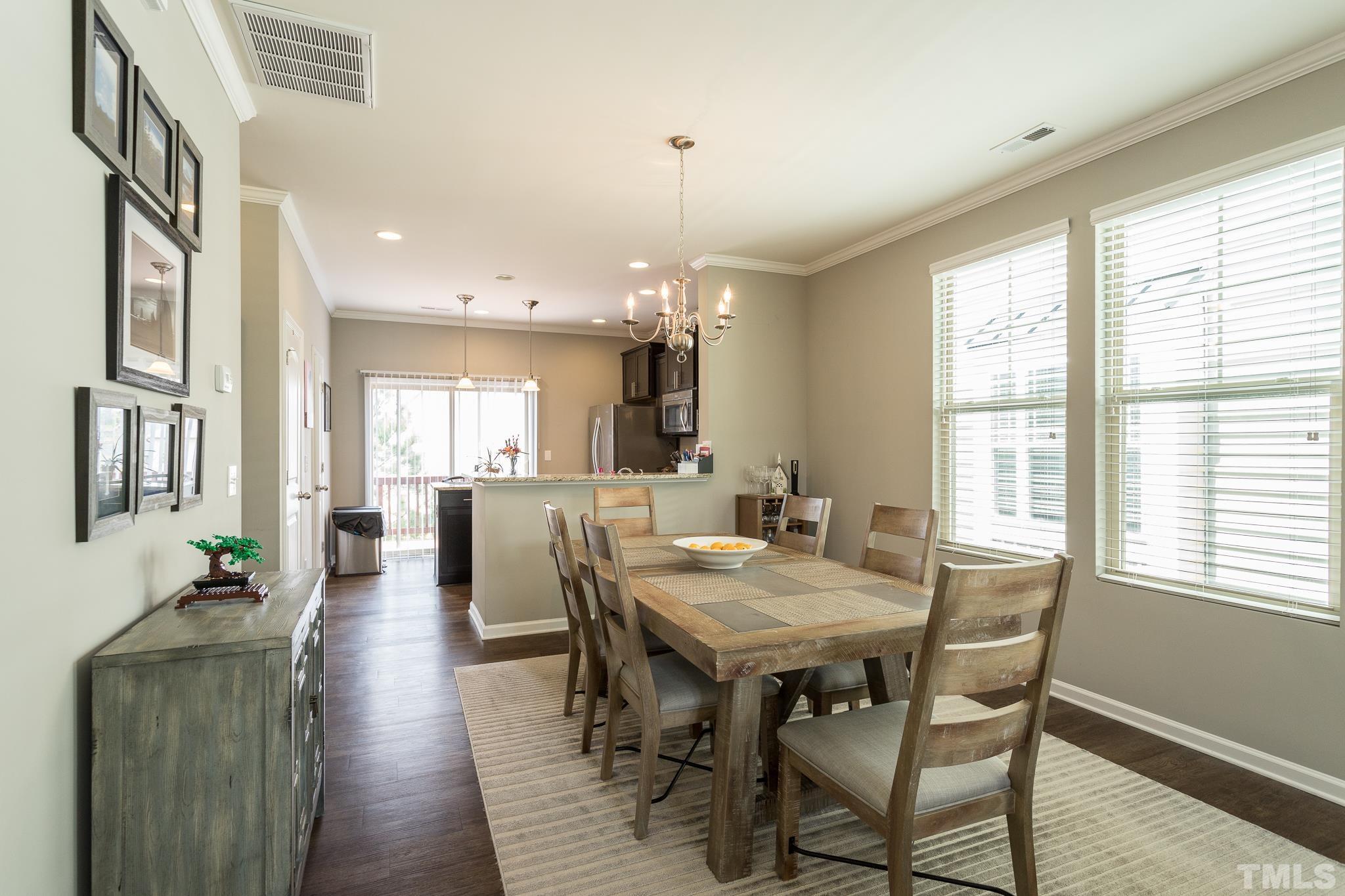 218 Irving Way Durham, NC 27703 - Photo 9 of 41 a view of a a dining room with furniture window and wooden floor