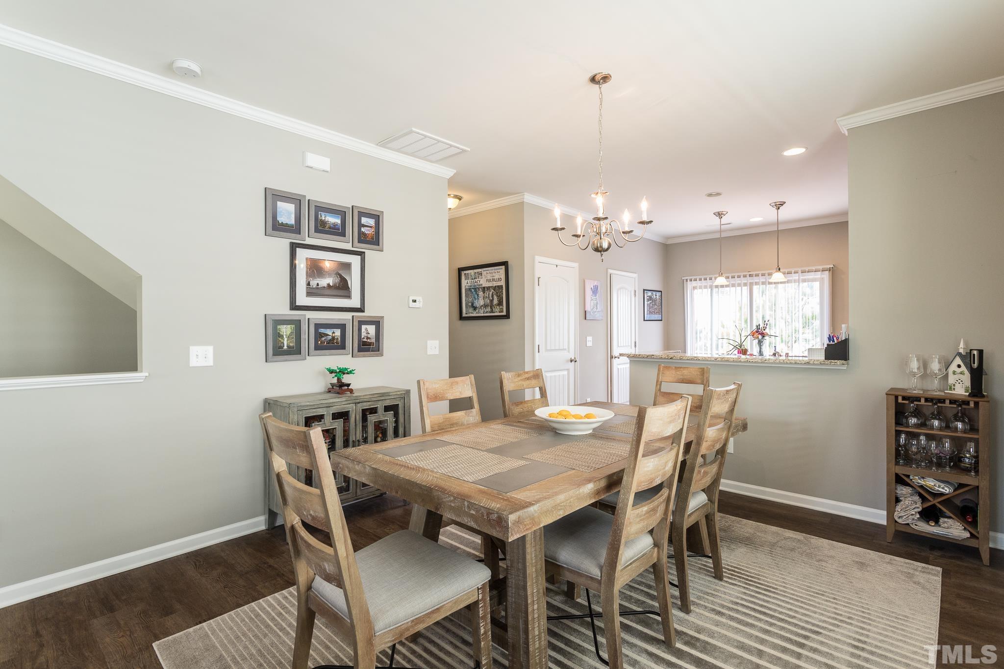 218 Irving Way Durham, NC 27703 - Photo 10 of 41 a view of a dining room with furniture and wooden floor