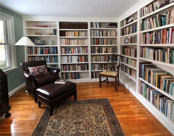 8 Meadowbrook Road Lincoln, MA 01773 - Photo 17 of 26 a living room with furniture and a book shelf