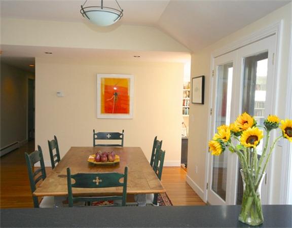 8 Meadowbrook Road Lincoln, MA 01773 - Photo 3 of 26 a dining room with furniture and flower vase with flowers