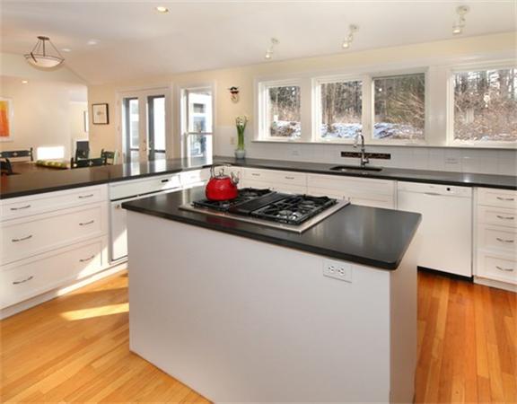 8 Meadowbrook Road Lincoln, MA 01773 - Photo 5 of 26 a kitchen with stainless steel appliances granite countertop a sink stove and cabinets