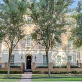 a view of a white house with a yard