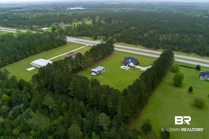 24541 Baldwin Beach Expressway Robertsdale, AL 36567 - Photo 41 of 51 Drone / aerial view with a rural view