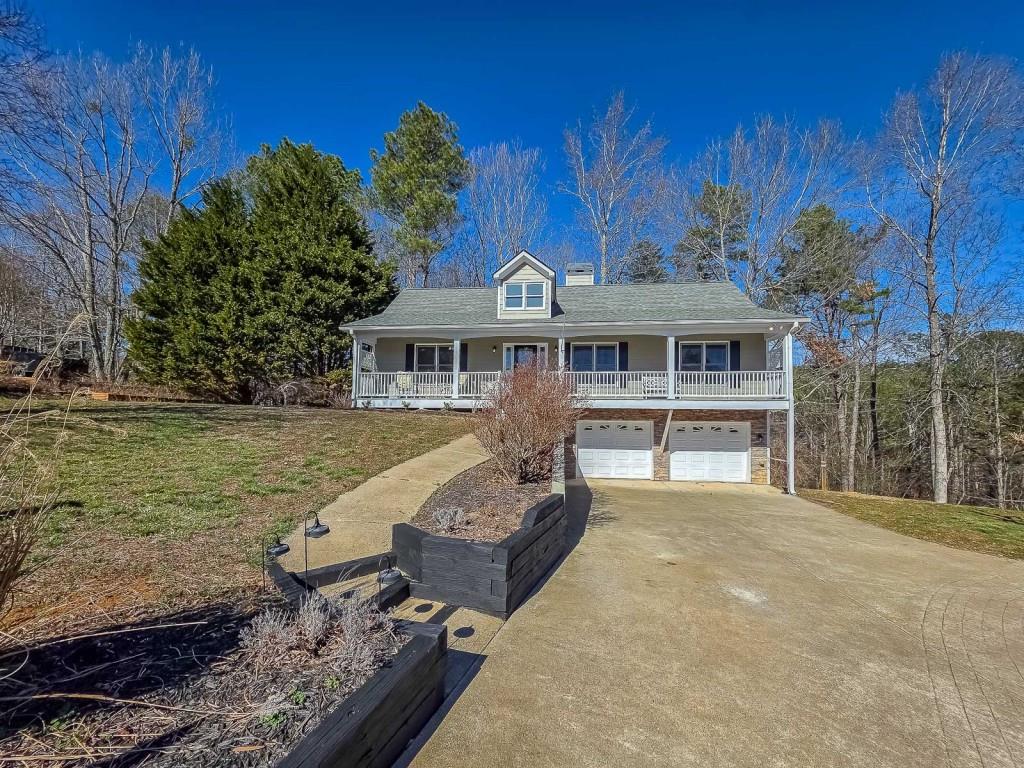 165 Horseshoe Bend Jasper, GA 30143 - Photo 3 of 44 a front view of a house with a yard