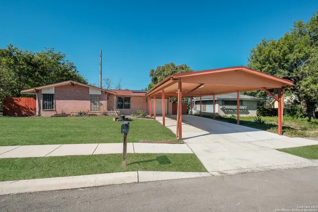 a patio with a yard table and chairs