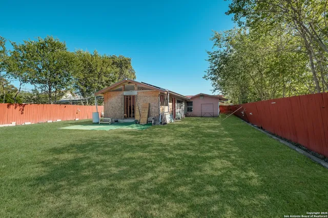 a backyard of a house with lots of green space