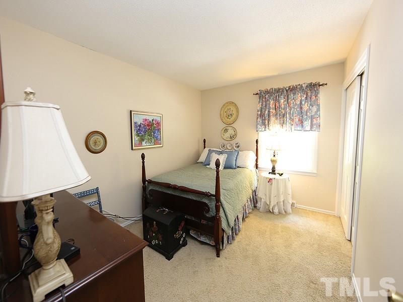 3163 Morningside Drive Raleigh, NC 27607 - Photo 12 of 18 a bed room with furniture and a window