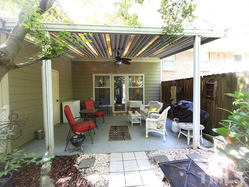 3163 Morningside Drive Raleigh, NC 27607 - Photo 16 of 18 a living room with patio furniture and a potted plant