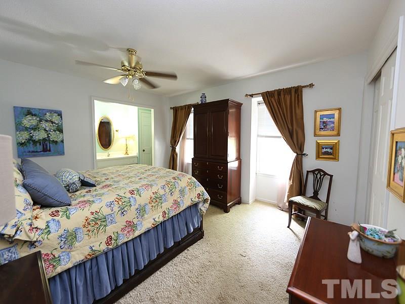 3163 Morningside Drive Raleigh, NC 27607 - Photo 8 of 18 a bedroom with bed and window