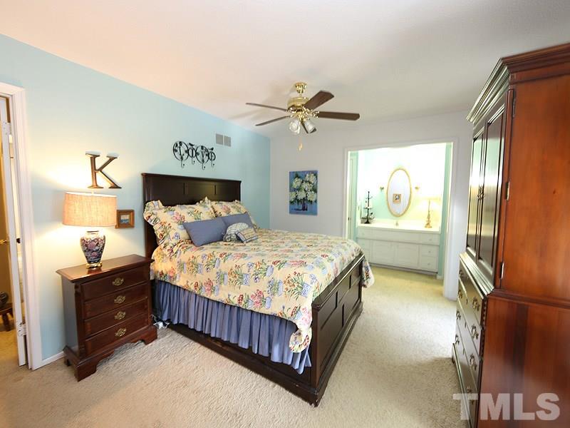 3163 Morningside Drive Raleigh, NC 27607 - Photo 9 of 18 a bedroom with a bed dresser and a window