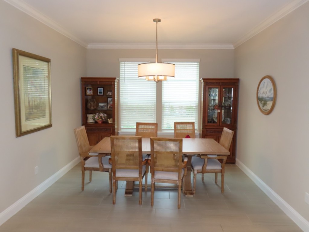 75136 White Rabbit Avenue Yulee, FL 32097 - Photo 13 of 23 a dining room with furniture and window
