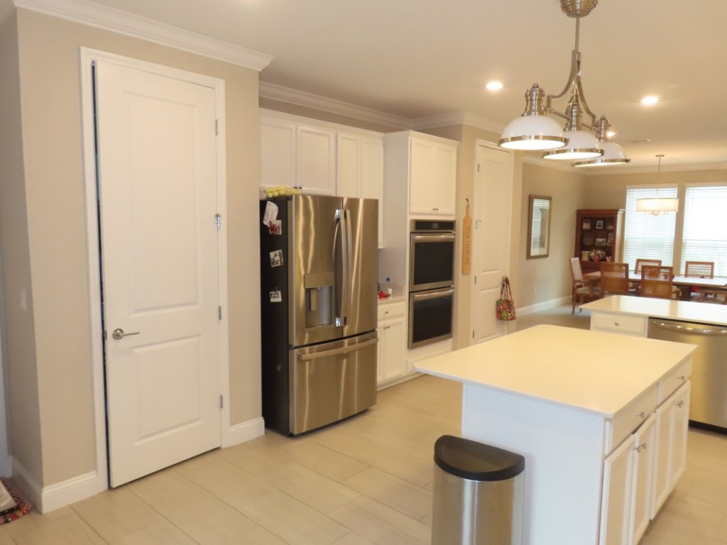 75136 White Rabbit Avenue Yulee, FL 32097 - Photo 14 of 23 a kitchen with stainless steel appliances granite countertop a refrigerator a oven and a sink