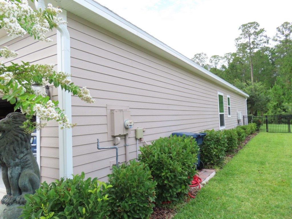 75136 White Rabbit Avenue Yulee, FL 32097 - Photo 2 of 23 a view of a backyard with plants