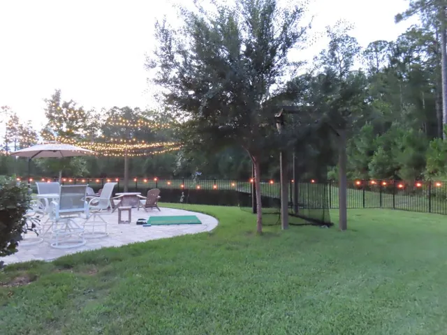 a view of a park with bench and trees