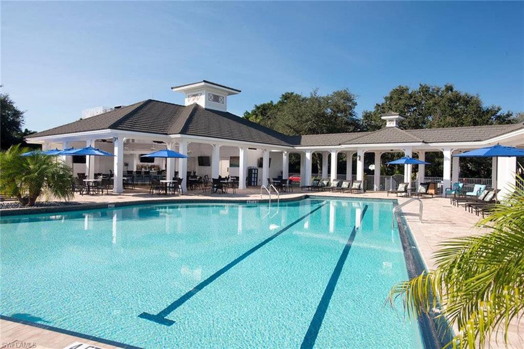 433 Crestwood Road Naples, FL 34113 - Photo 37 of 50 a view of a house with a swimming pool