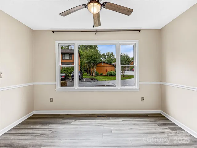 a kitchen with a stove sink and cabinets