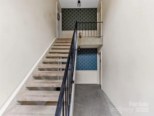 a view of a house with a yard and tree s