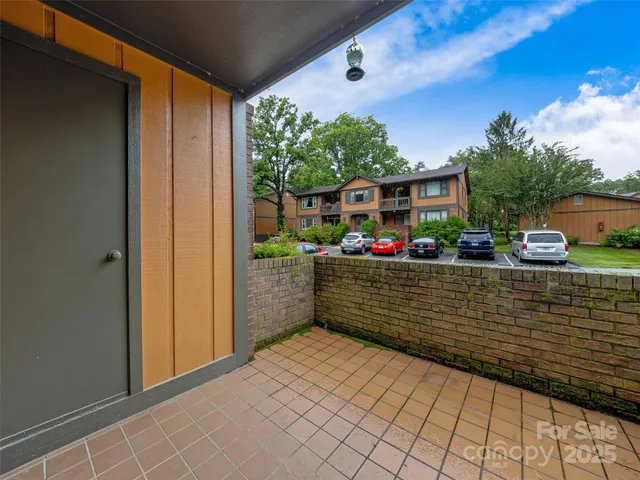 a living room with furniture a rug and a flat screen tv