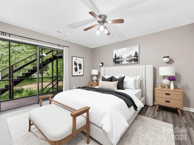 a bedroom with a bed couch and window