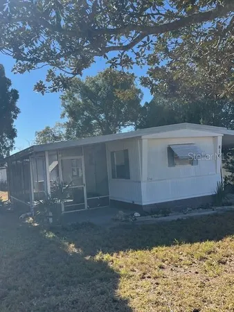 a bathroom with a sink a toilet a mirror and vanity