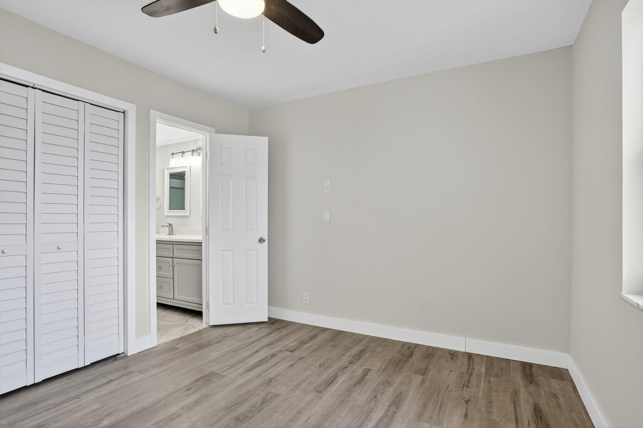 3201 Northeast 14th Street Causeway, Unit 501 Pompano Beach, FL 33062 - Photo 6 of 32 wooden floor in an empty room with a window