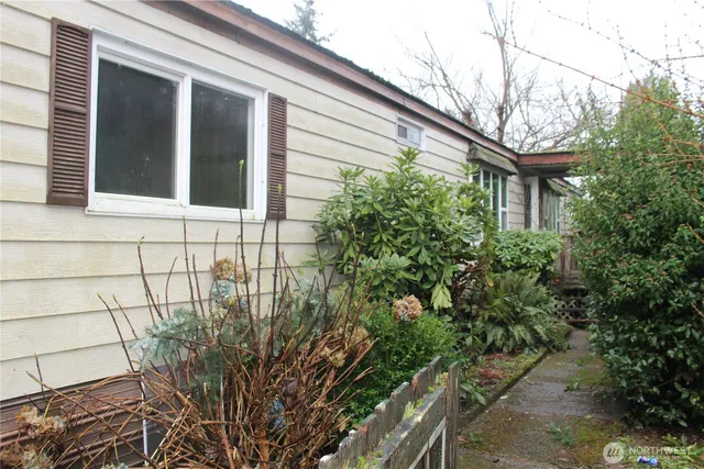 a yellow house with trees in front of it