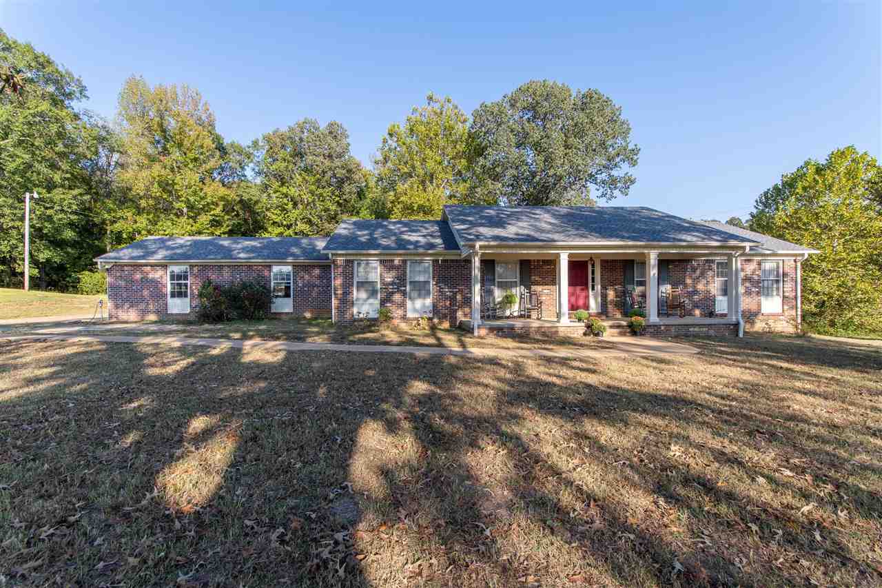 4560 Clifton Road Savannah, TN 38372 - Photo 1 of 25 a front view of a house with a yard