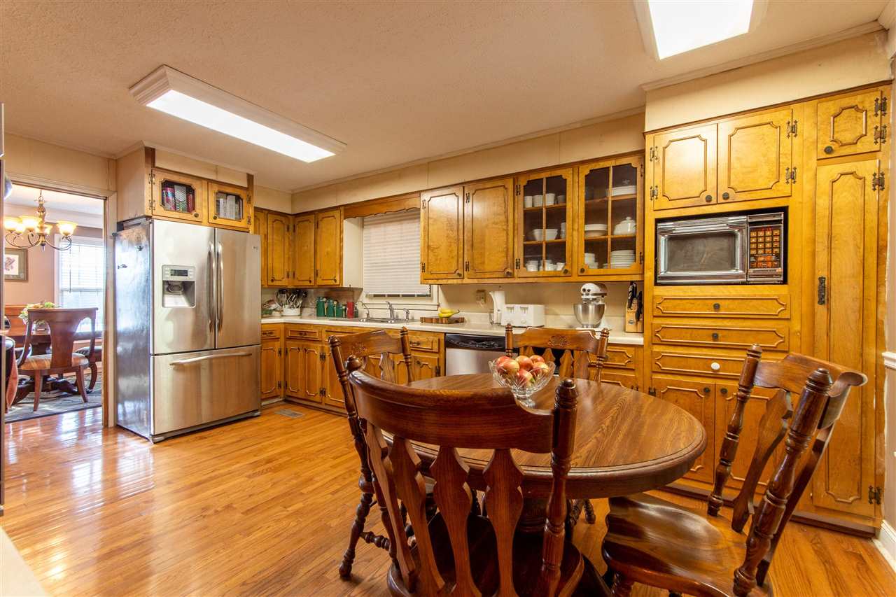 4560 Clifton Road Savannah, TN 38372 - Photo 14 of 25 a view of a dining room with furniture and wooden floor