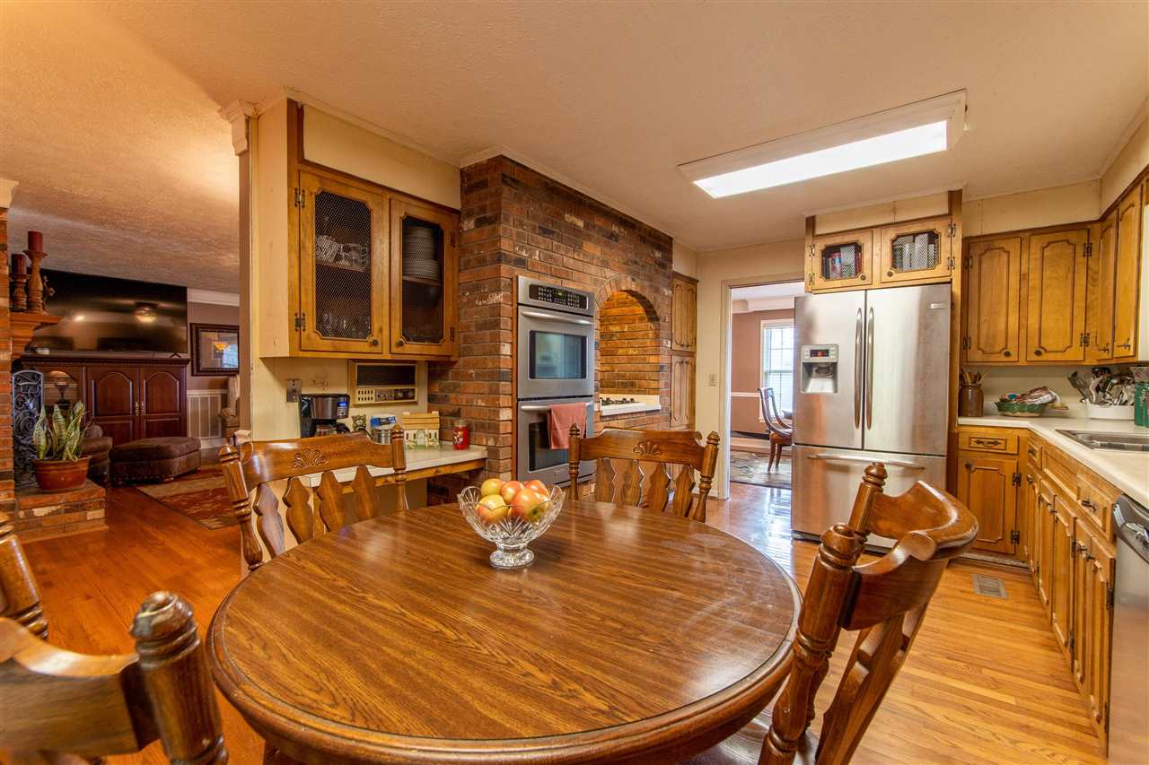 4560 Clifton Road Savannah, TN 38372 - Photo 16 of 25 a room with stainless steel appliances dining table and chairs