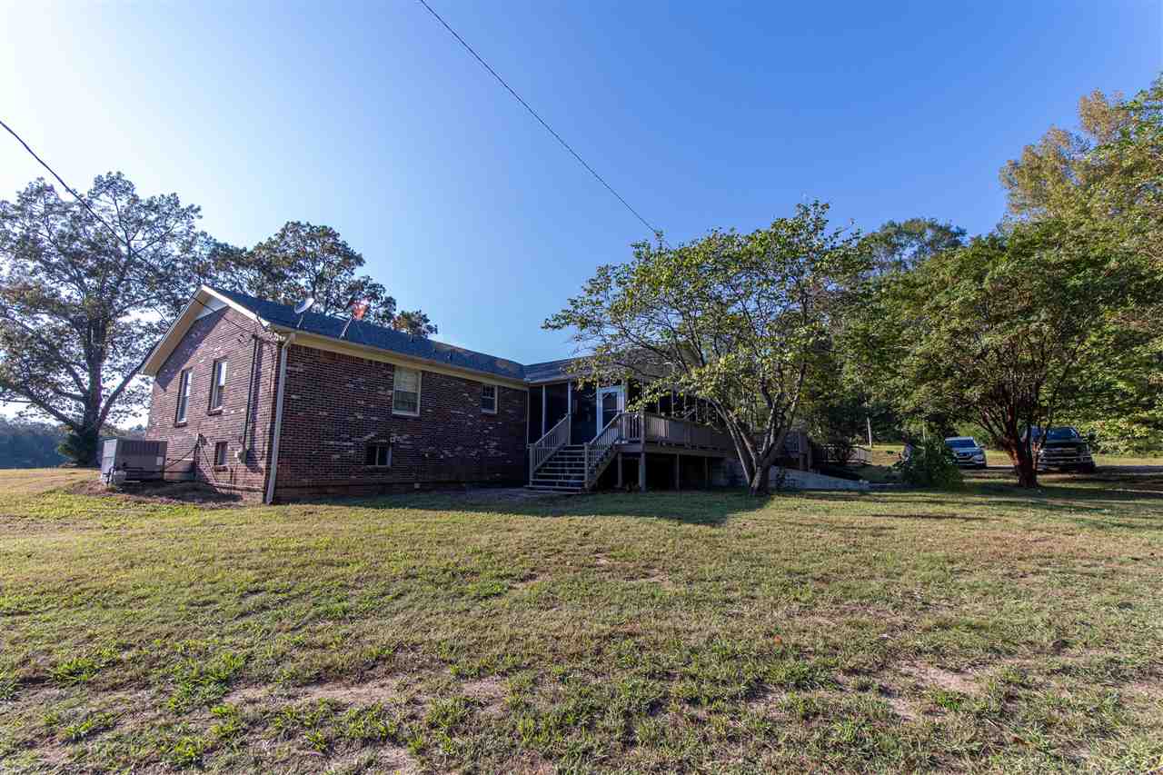 4560 Clifton Road Savannah, TN 38372 - Photo 25 of 25 a view of a house with a yard and garage