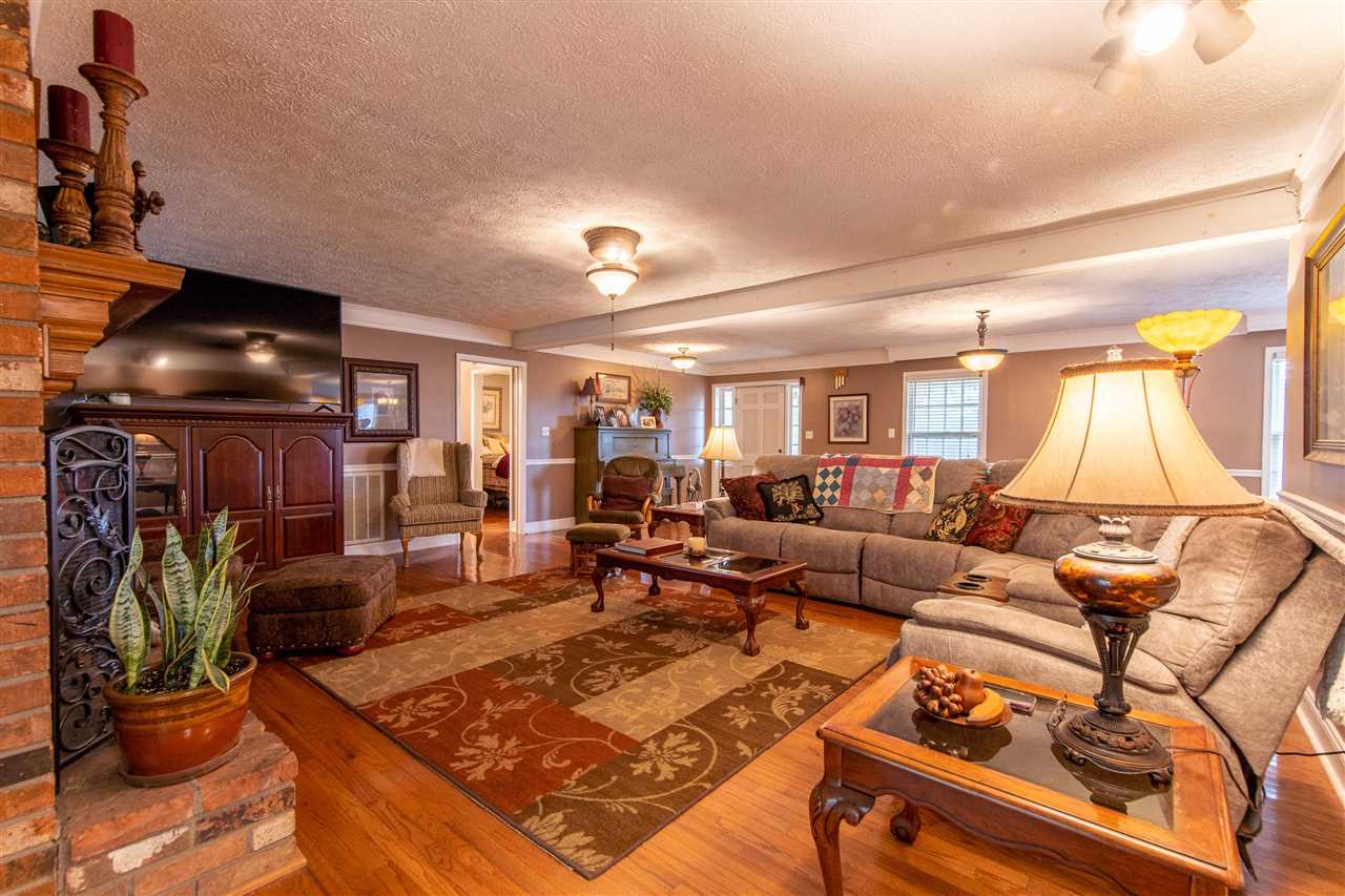 4560 Clifton Road Savannah, TN 38372 - Photo 5 of 25 a living room with furniture a dining table and a potted plant