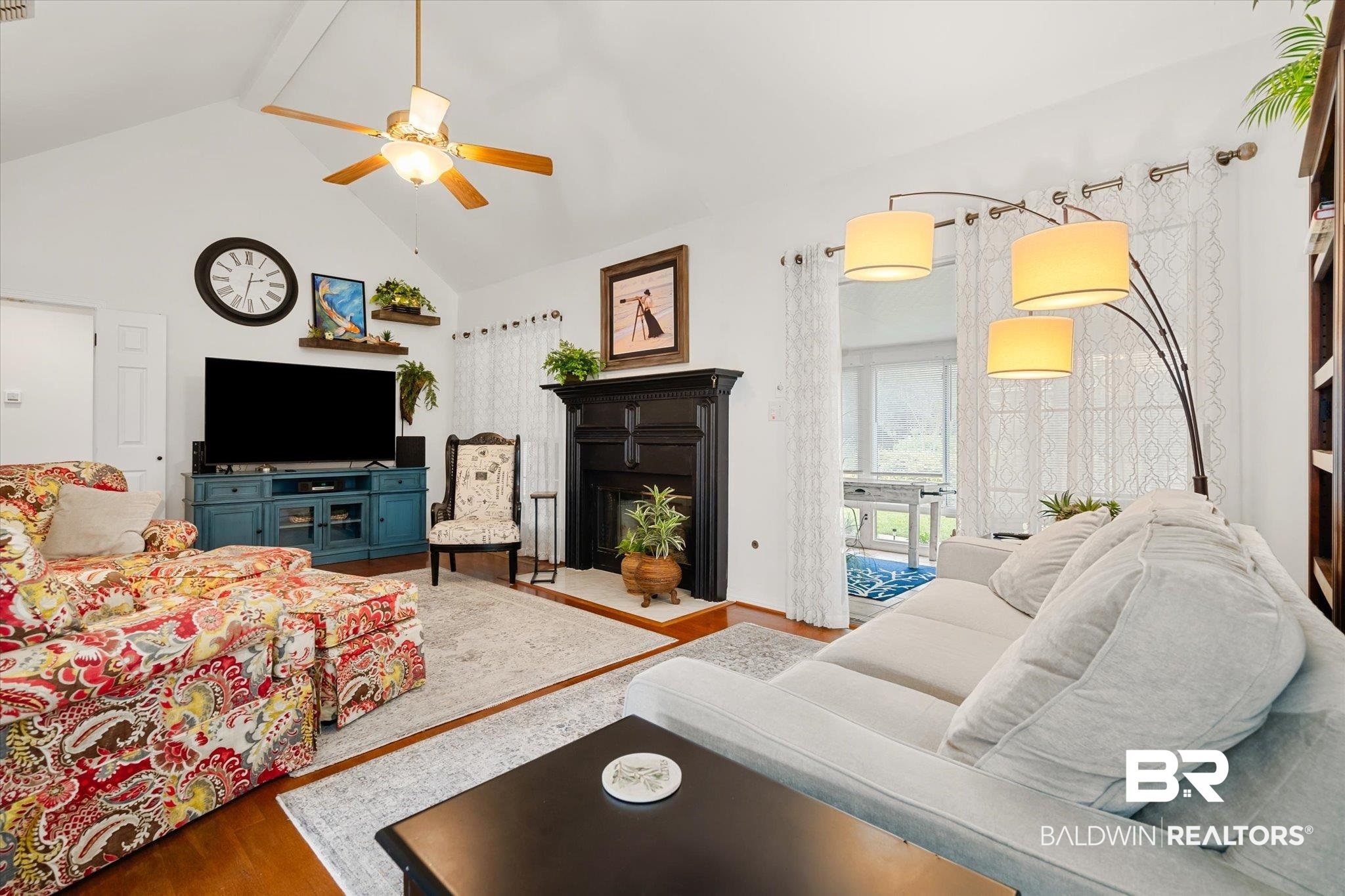 19924 Hunters Loop Fairhope, AL 36532 - Photo 12 of 40 Living room with hardwood / wood-style flooring, ceiling fan, beamed ceiling, and high vaulted ceiling