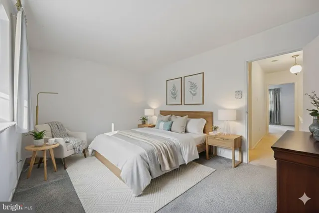 a bedroom with a bed and a mirror