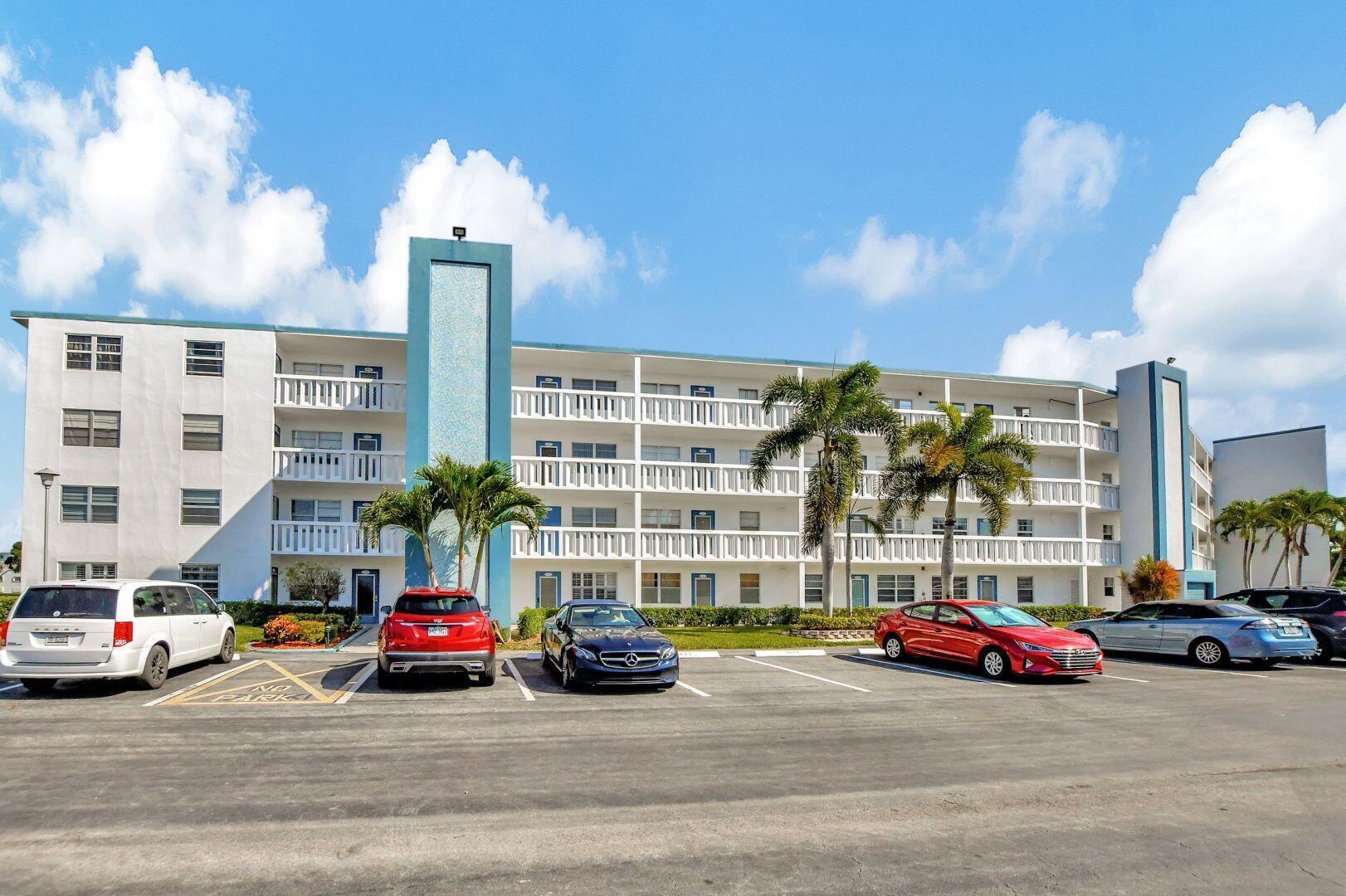 1047 Exeter C Boca Raton, FL 33434 - Photo 1 of 37 a car parked in front of a building